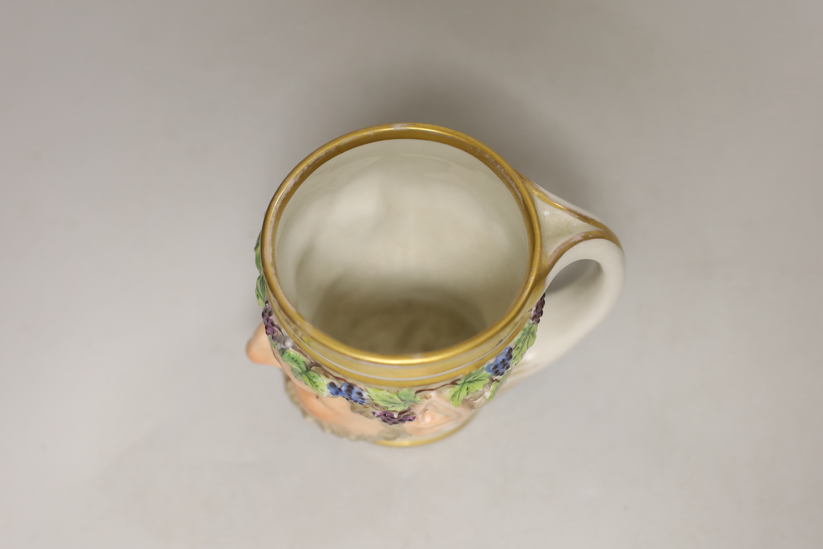 A Vienna porcelain satyr cup, impressed number 827, possibly for the date 1827, 10cm high